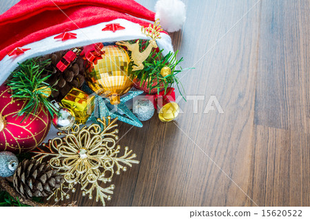 Santa Hat with Christmas decorations on wooden   15620522