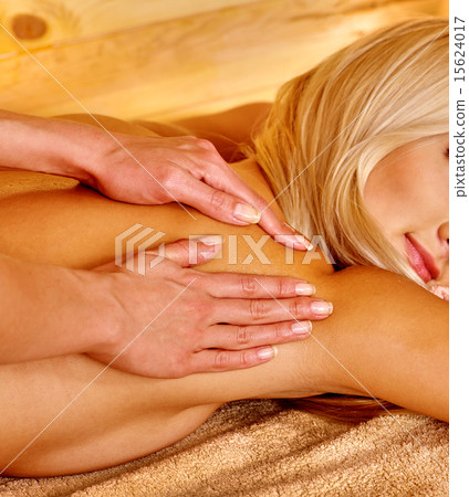 Woman getting herbal ball massage  . 15624017