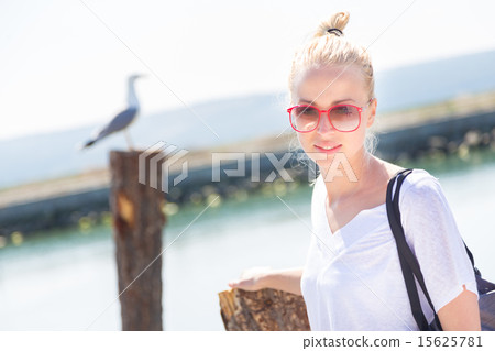 Woman on the beach in summertime. Woman on the beach in summertime. 15625781