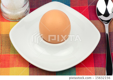 Breakfast egg in an egg cup with spoon and salt 15632156