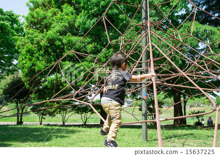A boy playing in a fresh green park A boy playing in a fresh green park 15637225