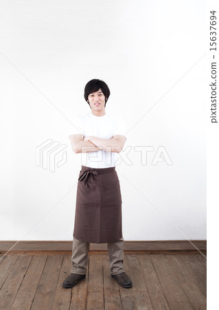 A young man with an apron 15637694