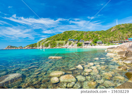 rocks on the beach with blue sky and mountain rocks on the beach with blue sky and mountain 15638229