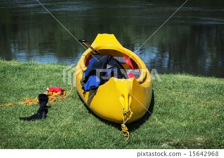 Yellow canoe boat on the shore Yellow canoe boat on the shore 15642968