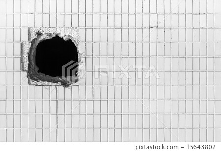 Hole on the old white wall Hole on the old white wall 15643802