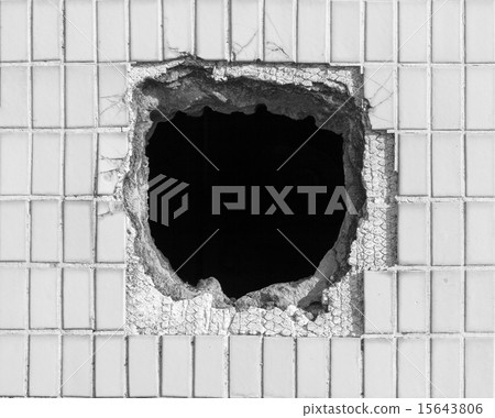 Hole on the old white wall Hole on the old white wall 15643806