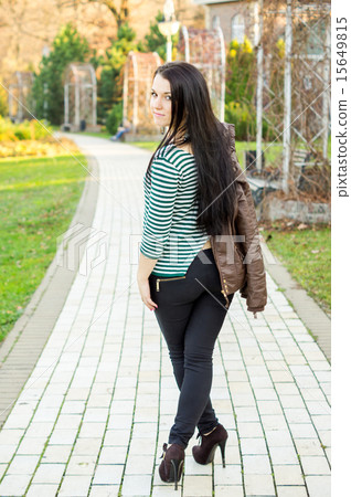 Young pretty woman standing on alley 15649815