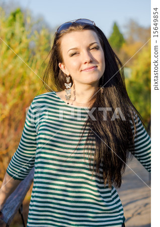 Young pretty woman in autumn park Young pretty woman in autumn park 15649854