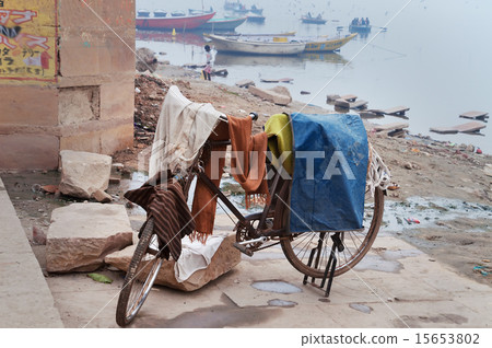 Laundry drying on bicycle near Ganga river in Ghat 15653802