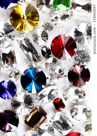 Large crystal strasses on a white background 15660897