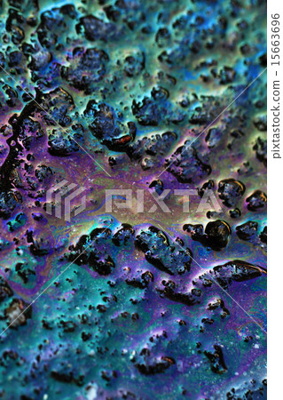 Color gasoline fuel spot on black asphalt 15663696