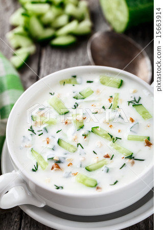 Cold soup with cucumbers, yogurt and fresh herbs 15663914