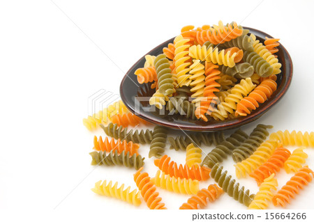 Pile of Pasta fusilli in black bowl 15664266