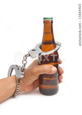 bottle beer and handcuffs,Drunk driving concept 15664403