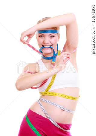 Obsessed fitness woman with a lot of colorful measure tapes 15671959