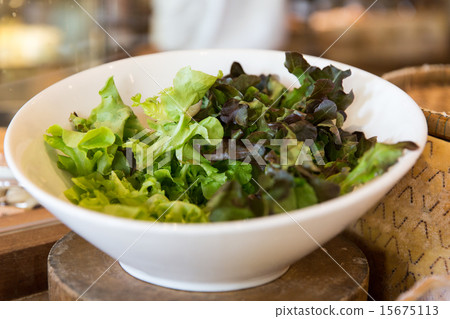 bowl of green salad lettuce at asian restaurant 15675113