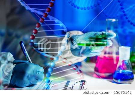 close up of scientist writing test results in lab 15675142