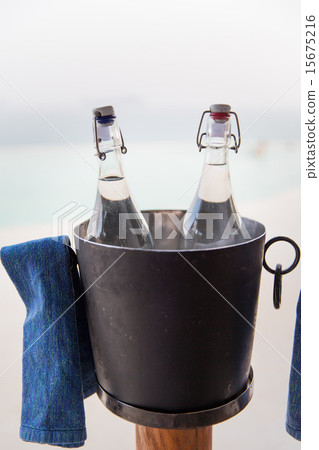 water bottles in ice bucket at hotel beach water bottles in ice bucket at hotel beach 15675216