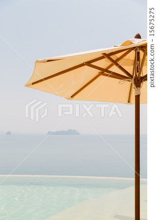 view from infinity edge pool with parasol to sea view from infinity edge pool with parasol to sea 15675275