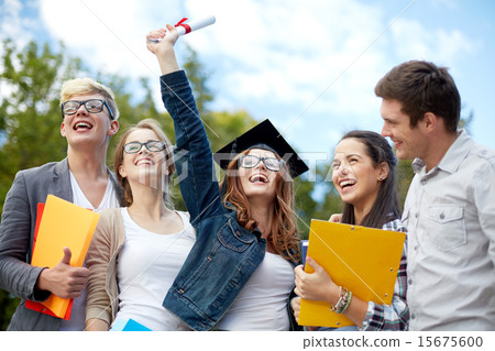 group of smiling students with diploma and folders group of smiling students with diploma and folders 15675600
