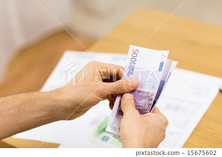 close up of man hands counting money at home close up of man hands counting money at home 15675602