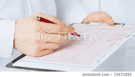 male doctor hands holding cardiogram 15675885