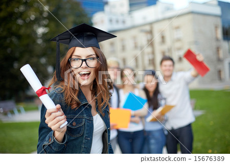 group of smiling students with diploma and folders 15676389