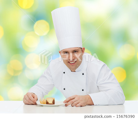 happy male chef cook decorating dessert 15676390