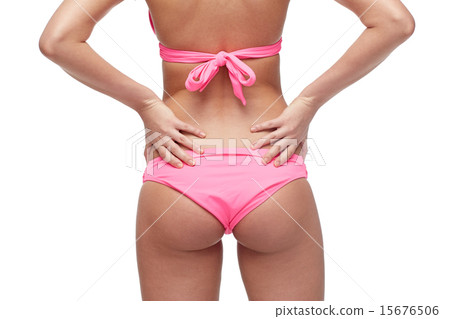 close up of young woman buttocks in pink bikini close up of young woman buttocks in pink bikini 15676506