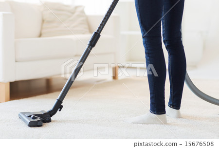 close up of woman legs with vacuum cleaner at home close up of woman legs with vacuum cleaner at home 15676508