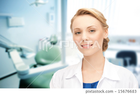 happy young female dentist with tools 15676683