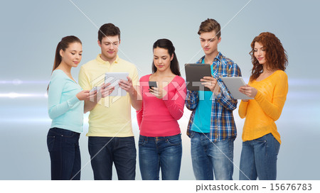 group of teenagers with smartphones and tablet pc 15676783