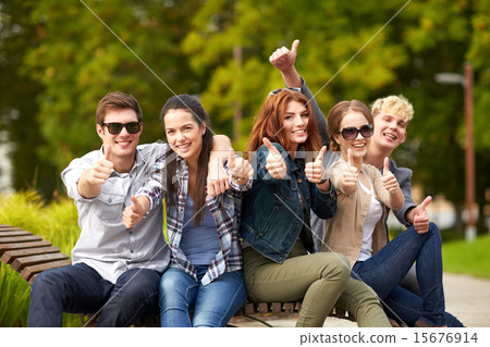 group of students or teenagers showing thumbs up group of students or teenagers showing thumbs up 15676914