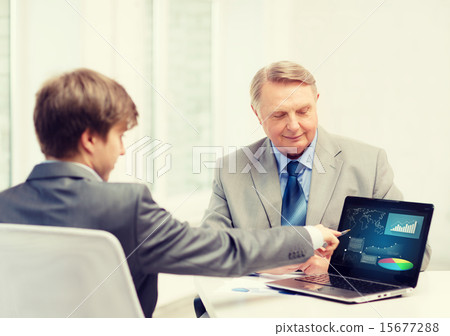 older man and young man with laptop computer older man and young man with laptop computer 15677288