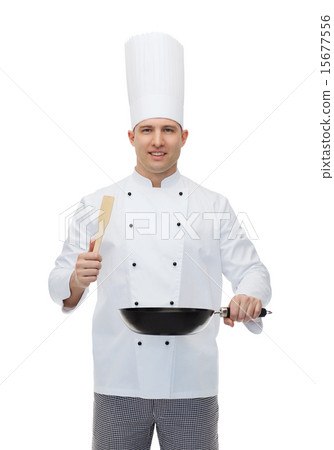 happy male chef holding frying pan and spatula happy male chef holding frying pan and spatula 15677556