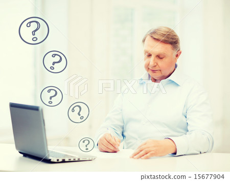 old man filling a form at home 15677904