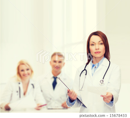calm female doctor with clipboard calm female doctor with clipboard 15678433
