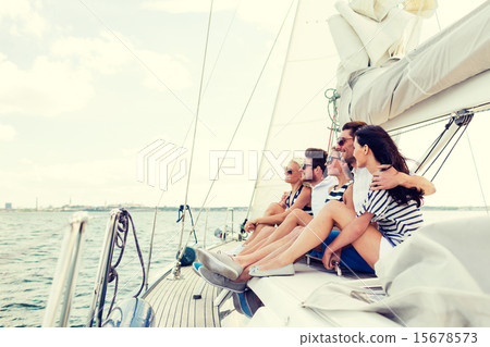 smiling friends sitting on yacht deck smiling friends sitting on yacht deck 15678573