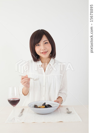 A woman eating pasta 15678895