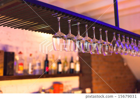 Empty glass on a bar in night club 15679031