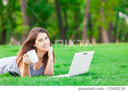 girl with laptop computer and cup girl with laptop computer and cup 15680139