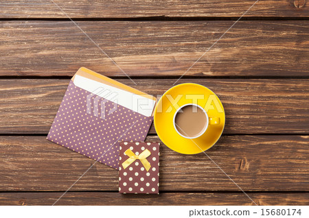 Cup of coffee and envelope with gift boxes 15680174