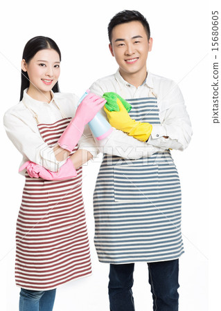 man and woman holding cleaning supplies man and woman holding cleaning supplies 15680605