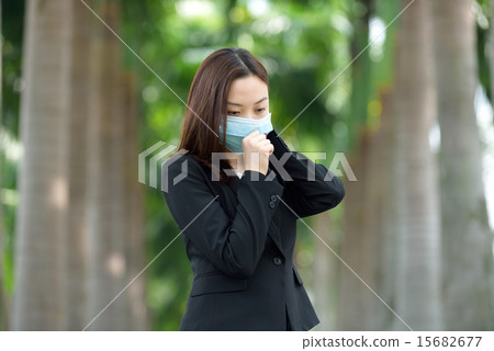 Chinese businesswoman wearing medical mask Chinese businesswoman wearing medical mask 15682677