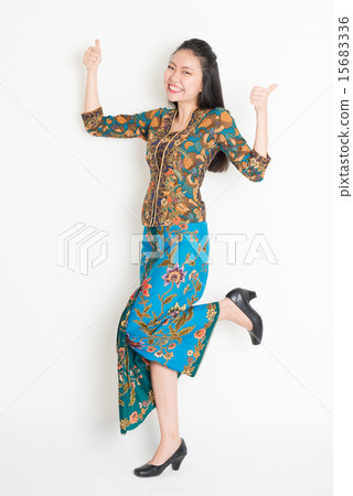 Asian girl thumbs up and jumping around Asian girl thumbs up and jumping around 15683336