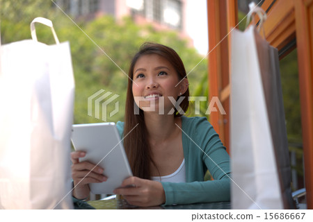 Young asian girl doing online shopping 15686667