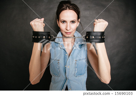 Arrest. Criminal woman prisoner showing handcuffs Arrest. Criminal woman prisoner showing handcuffs 15690103