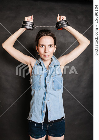 Arrest and jail. Criminal woman prisoner girl in handcuffs Arrest and jail. Criminal woman prisoner girl in handcuffs 15690104