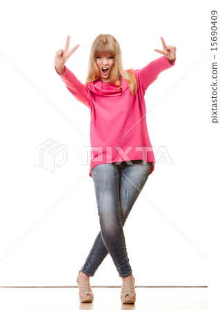 Happy woman showing victory sign 15690409