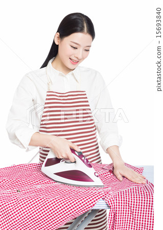young housewife ironing 15693840
